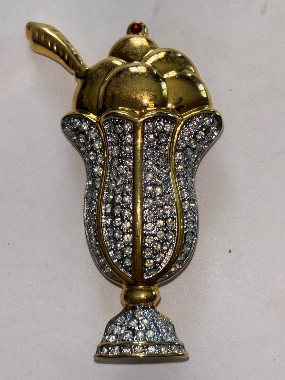 ICE CREAM SUNDAE BROOCH GOLD TONED WITH RHINESTONES HAS A SPOON CREAM AND CHERRY